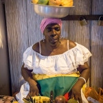 Colombian ladyA street vendor sells fruit on the streets of Cartagena in Colombia.